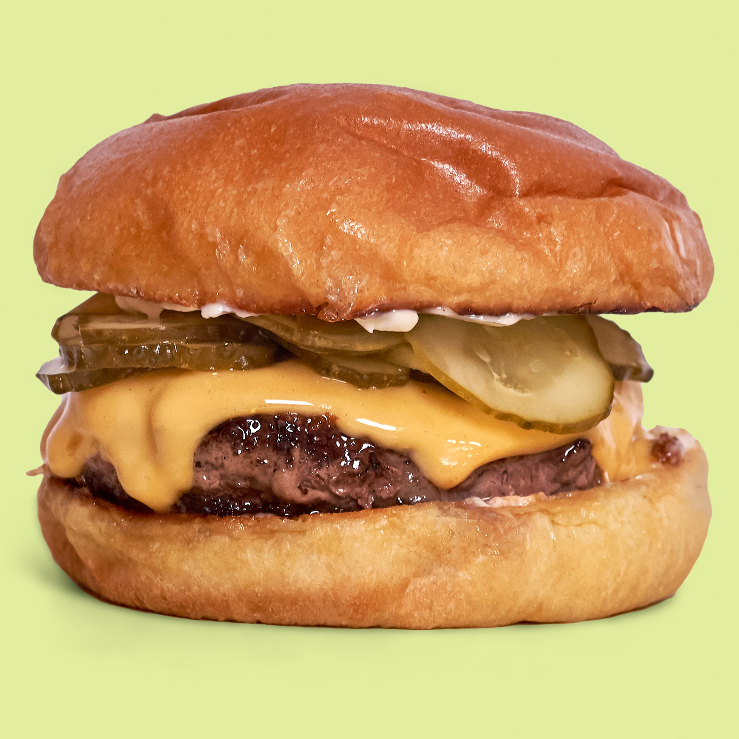 A Richard Eaglespoon burger with a green background.