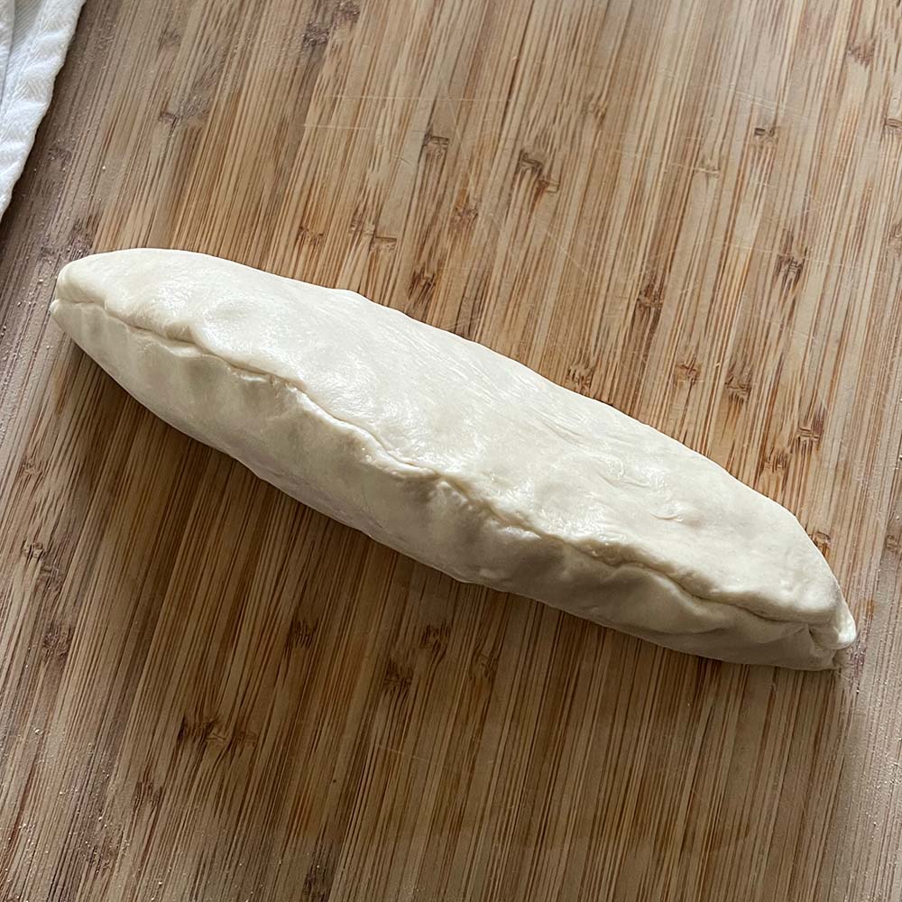 Dough folded and pinched but not yet rolled to size