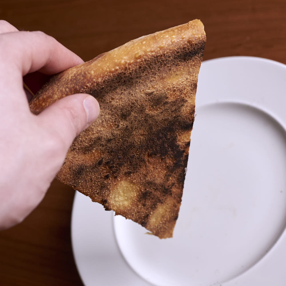 Pizza baked in a typical home oven on a 3/8-inch-thick steel plate.