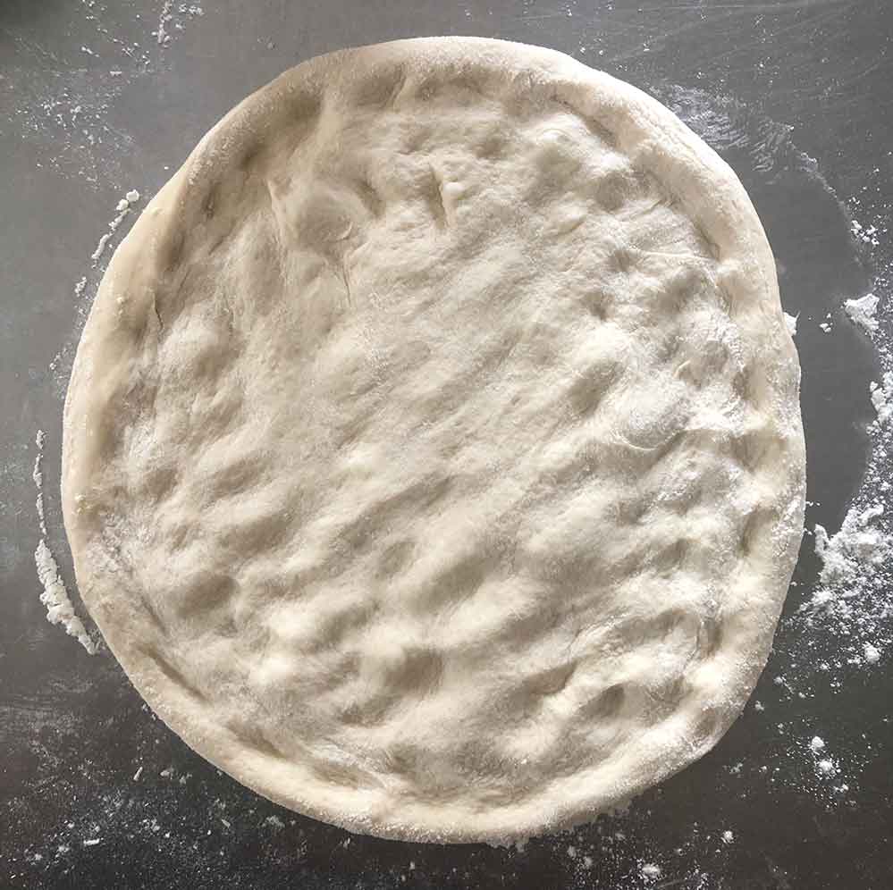 A dough that’s been poked throughout the entire interior.