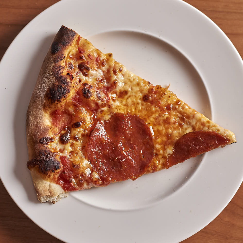 A pizza with aged mozzarella and Salumeria Biellese pepperoni. Baked in a typical home oven on a 3/8-inch-thick steel plate.