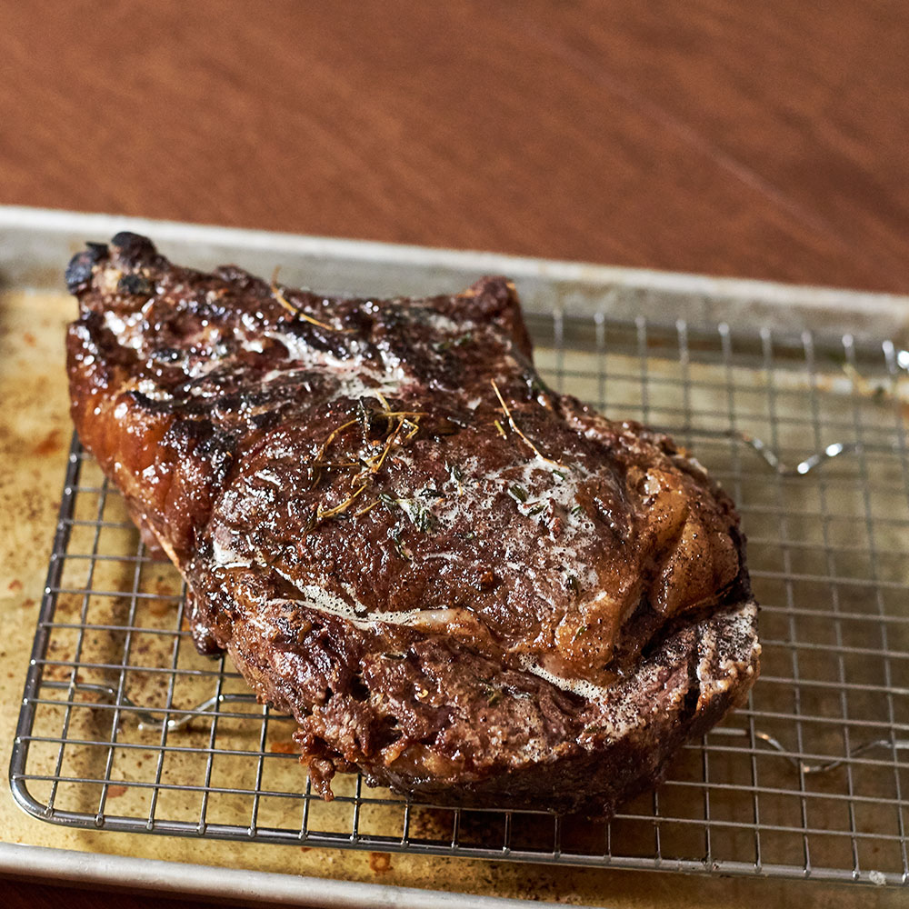 A rib steak fresh out of the oven.