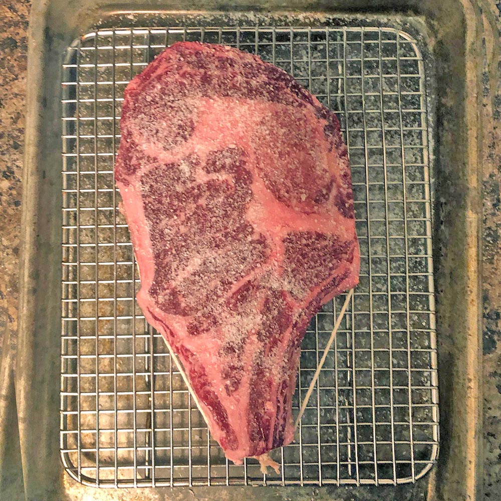 Flannery Beef rib steak trussed with butcher’s twine and salted with Diamond Crystal Kosher Salt.