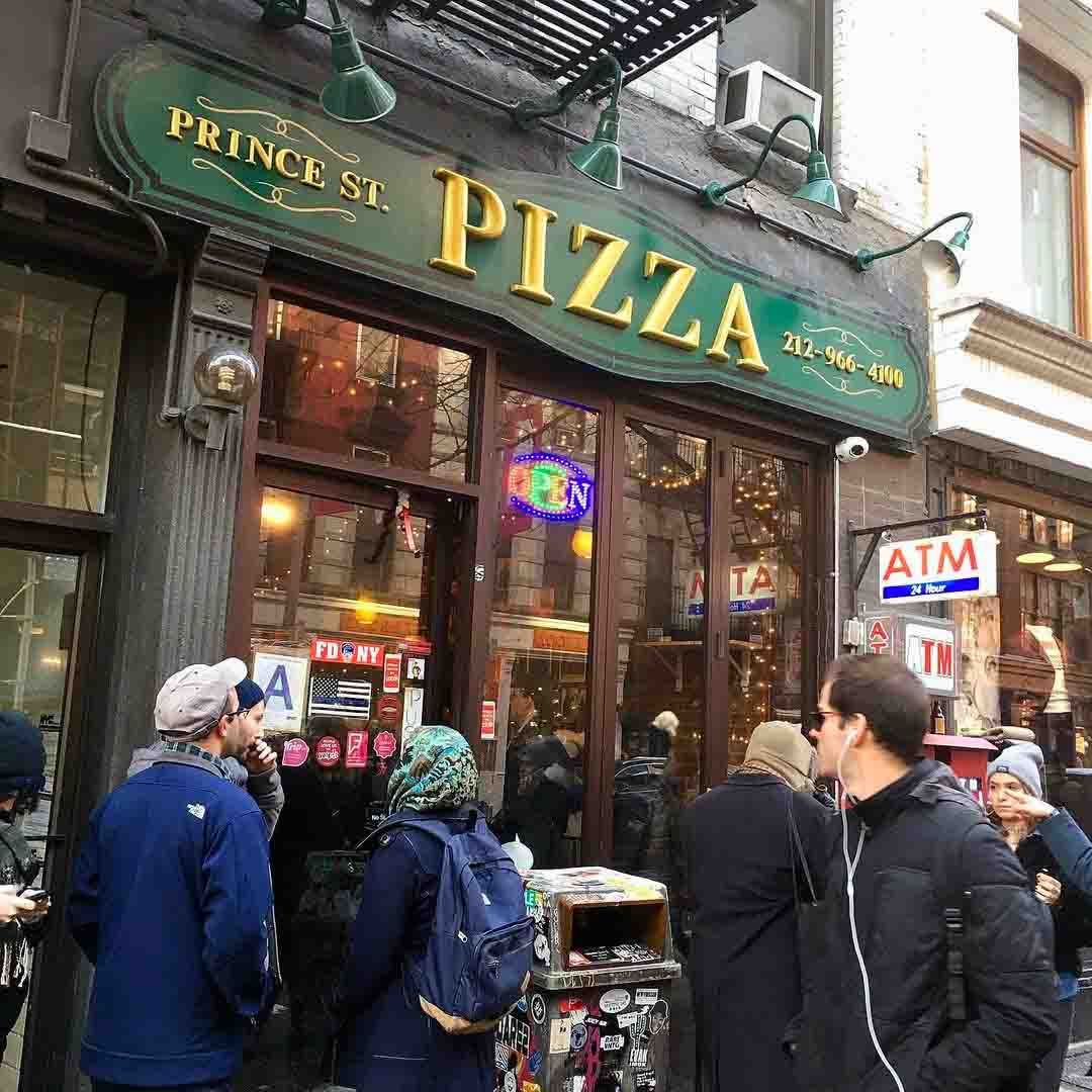 Photo of Prince Street Pizza store front posted on Instagram, featuring a Thin Blue Line flag sign on the pizzeria's front door. December 3, 2019